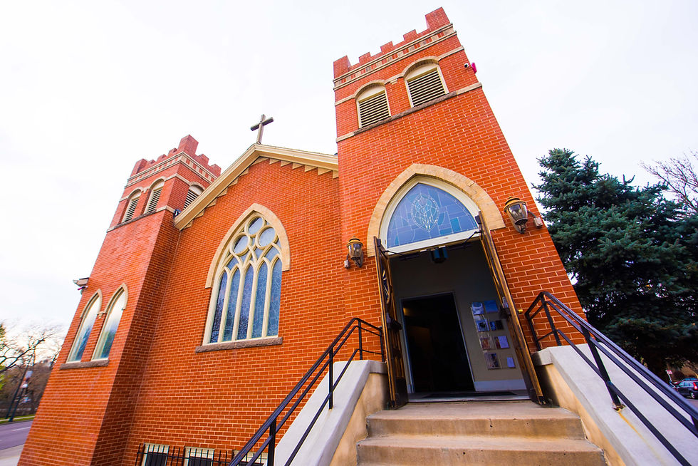 A red brick church with concrete trim